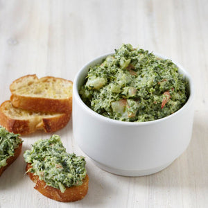 Creamy herb spinach dip with toasted baguette slices