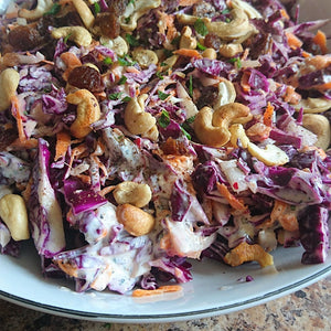 A colourful and fresh Middle Eastern coleslaw with red cabbage and cashew nuts