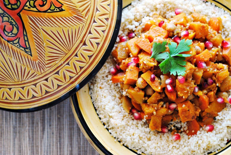 Moroccan-style vegetable tagine with squash, sweet potato, and couscous