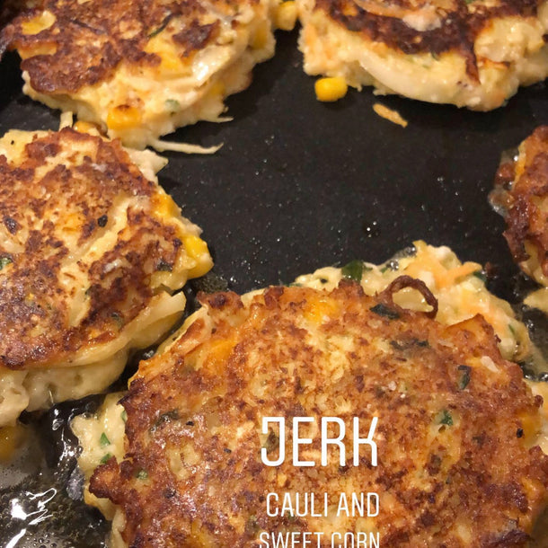Jerk cauliflower and sweetcorn fritters, sizzling in a frying pan