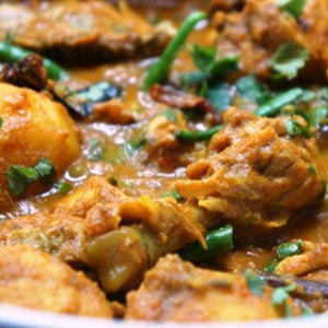 Spicy BBengali chicken curry in rich aromatic gravy