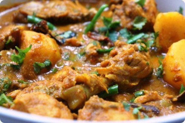 Spicy BBengali chicken curry in rich aromatic gravy