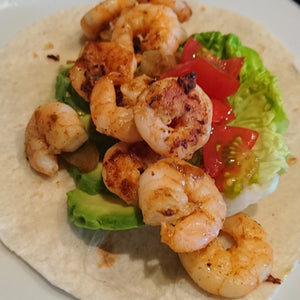 Tex Mex prawn and avocado wraps, with lettuce, tomato and sour cream