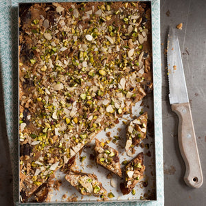 Date fudge topped with pistachios and sliced almonds