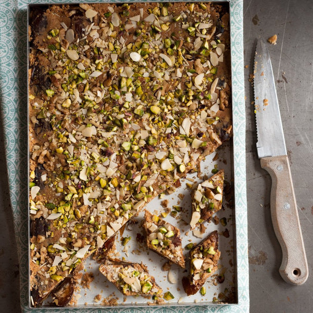 Date fudge topped with pistachios and sliced almonds