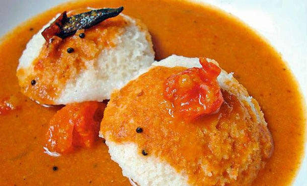 Traditional South Indian idli and sambar breakfast platter