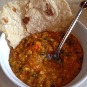 A Hearty Bowl of  Moroccan vegetable soup with warm flatbread