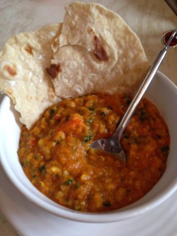 A Hearty Bowl of  Moroccan vegetable soup with warm flatbread