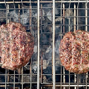 Za’atar lamb burgers with juicy lamb patties seasoned with za’atar spices, served in soft buns with fresh salad and sauce.