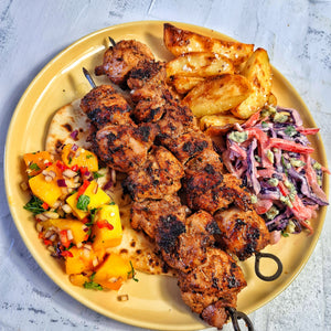 Jerk Chicken Skewers, Garlic & Thyme Potato Wedges, Blue Cheese Slaw, Mango, Chilli & Lime Salsa