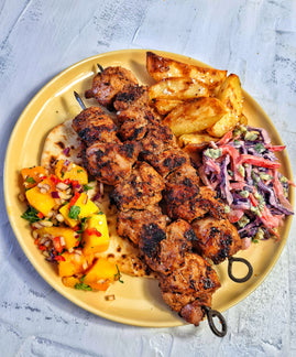 Jerk Chicken Skewers, Garlic & Thyme Potato Wedges, Blue Cheese Slaw, Mango, Chilli & Lime Salsa