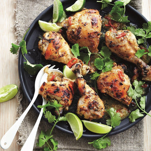 Tonga Chilli-Lime Chicken thighs and drumsticks served with wedges of fresh lime and fresh coriander