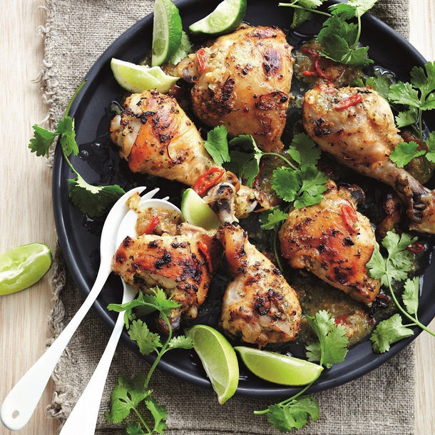 Tonga Chilli-Lime Chicken thighs and drumsticks served with wedges of fresh lime and fresh coriander
