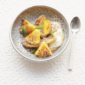 Sticky and Spicy Pineapple and Banana, sprinkled with with Cinnamon and served in a bowl