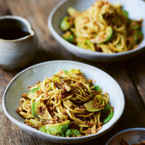 2 portions of Sprouts with Egg Noodles and Togarashi next to Spice Kitchen’s signature Togorashi Spice blend