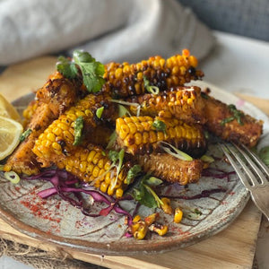 Corn ribs by Renu Bhardwaj featuring roasted corn cut into rib-like strips, seasoned with spices and lightly charred.