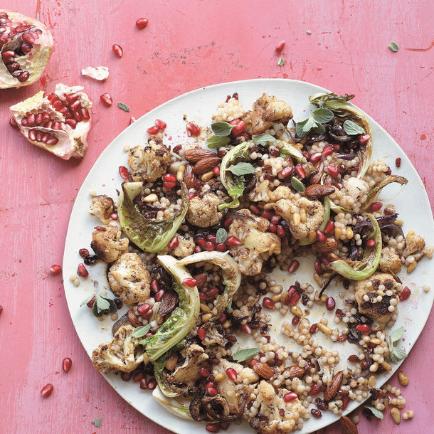 Pan-fried Cauliflower with Caramelized Red Onions, Couscous and Almonds served with a sprinkling of pomegranate