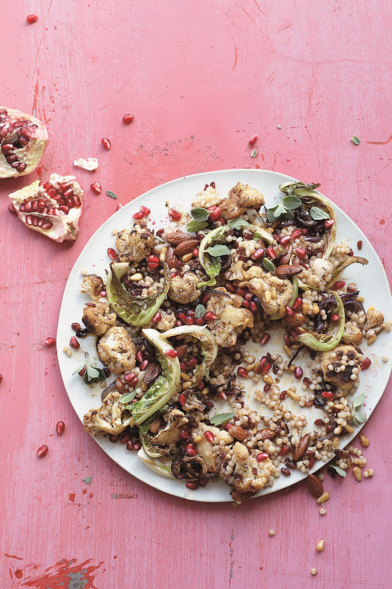 Pan-fried Cauliflower with Caramelized Red Onions, Couscous and Almonds served with a sprinkling of pomegranate