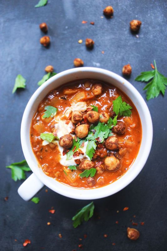 Tunisian harissa chickpea stew with chickpeas simmered in a spicy tomato broth, infused with harissa paste and herbs.