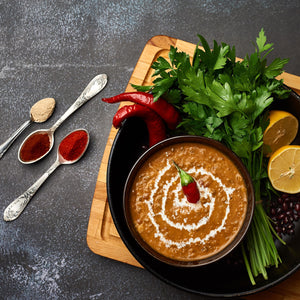 Dal makhani made with slow-cooked black lentils and kidney beans in a rich, creamy tomato-butter gravy, finished with herbs.  Excerpt: