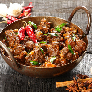 Kerala beef pepper fry with tender strips of beef cooked in black pepper, curry leaves, and spices, finished with a rich, glossy coating.