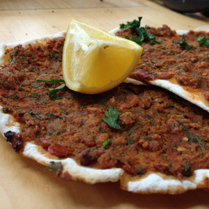 2 Lahmajouns (Turkish and Aremnian Pizzas) with a wedge of fresh lemon