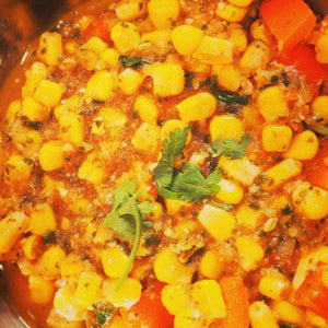 Flavorful corn masala served hot with fresh coriander