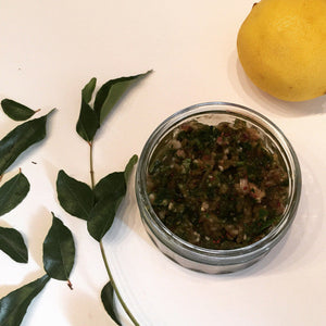 Savory curry leaves chutney garnished with fresh curry leaf sprigs
