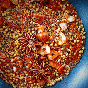 Homemade spice blend with cumin, coriander, and star anise