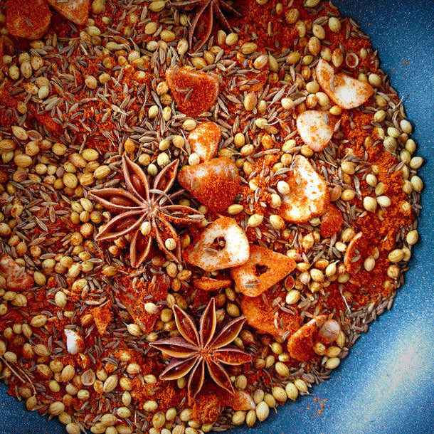 Homemade spice blend with cumin, coriander, and star anise