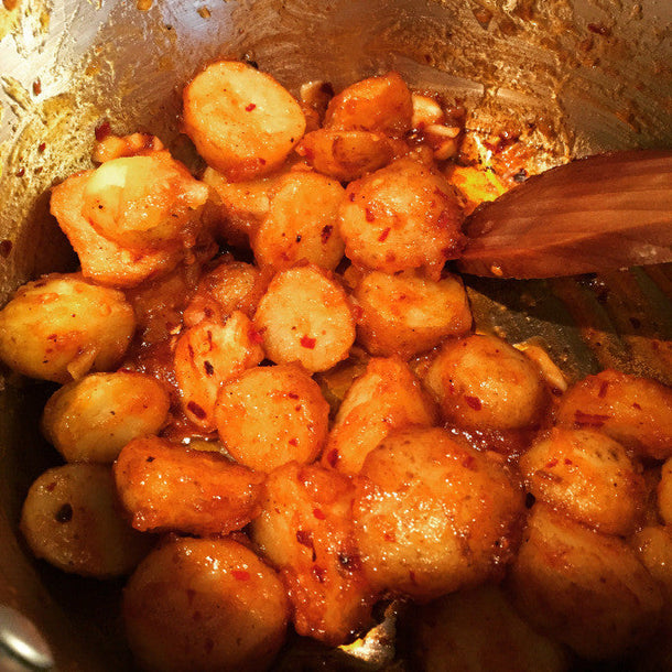 Close-up of chilli potatoes in rich savory glaze