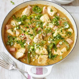 Cajun chicken gumbo with tender chicken simmered in a rich, spiced stew with vegetables and a dark, savoury broth.