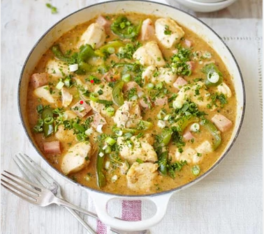 Cajun chicken gumbo with tender chicken simmered in a rich, spiced stew with vegetables and a dark, savoury broth.