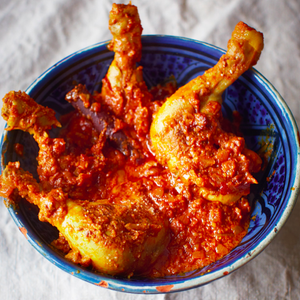 Traditional chicken curry with rich tomato and chili sauce