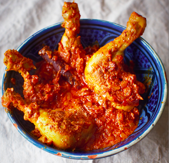 Traditional chicken curry with rich tomato and chili sauce