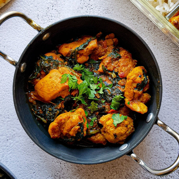Quick chicken saag by Mani with tender chicken cooked in a spiced spinach (saag) sauce, finished with herbs.