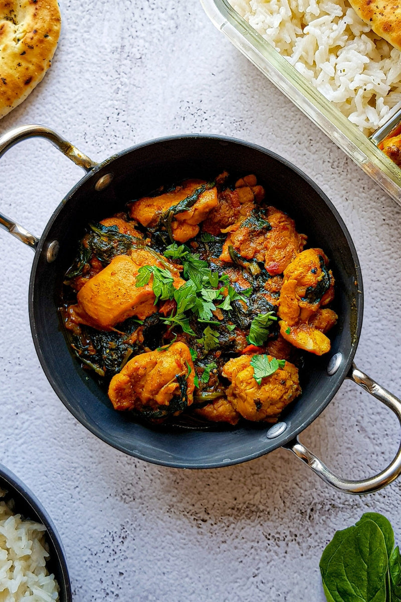 Quick chicken saag by Mani with tender chicken cooked in a spiced spinach (saag) sauce, finished with herbs.