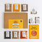 Spice Kitchen Indian spice collection with packaging and recipe guide on a white background