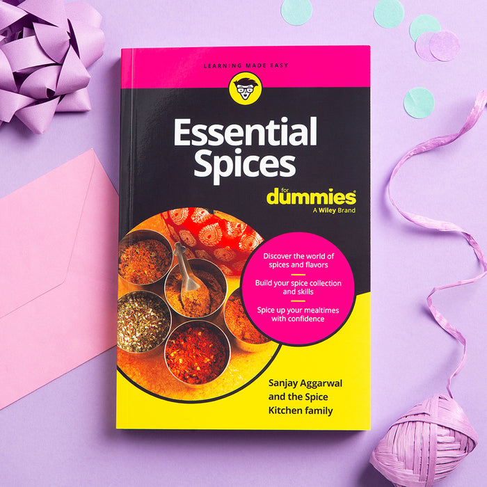 Book titled 'Essential Spices for Dummies' on a purple background with decorative elements.