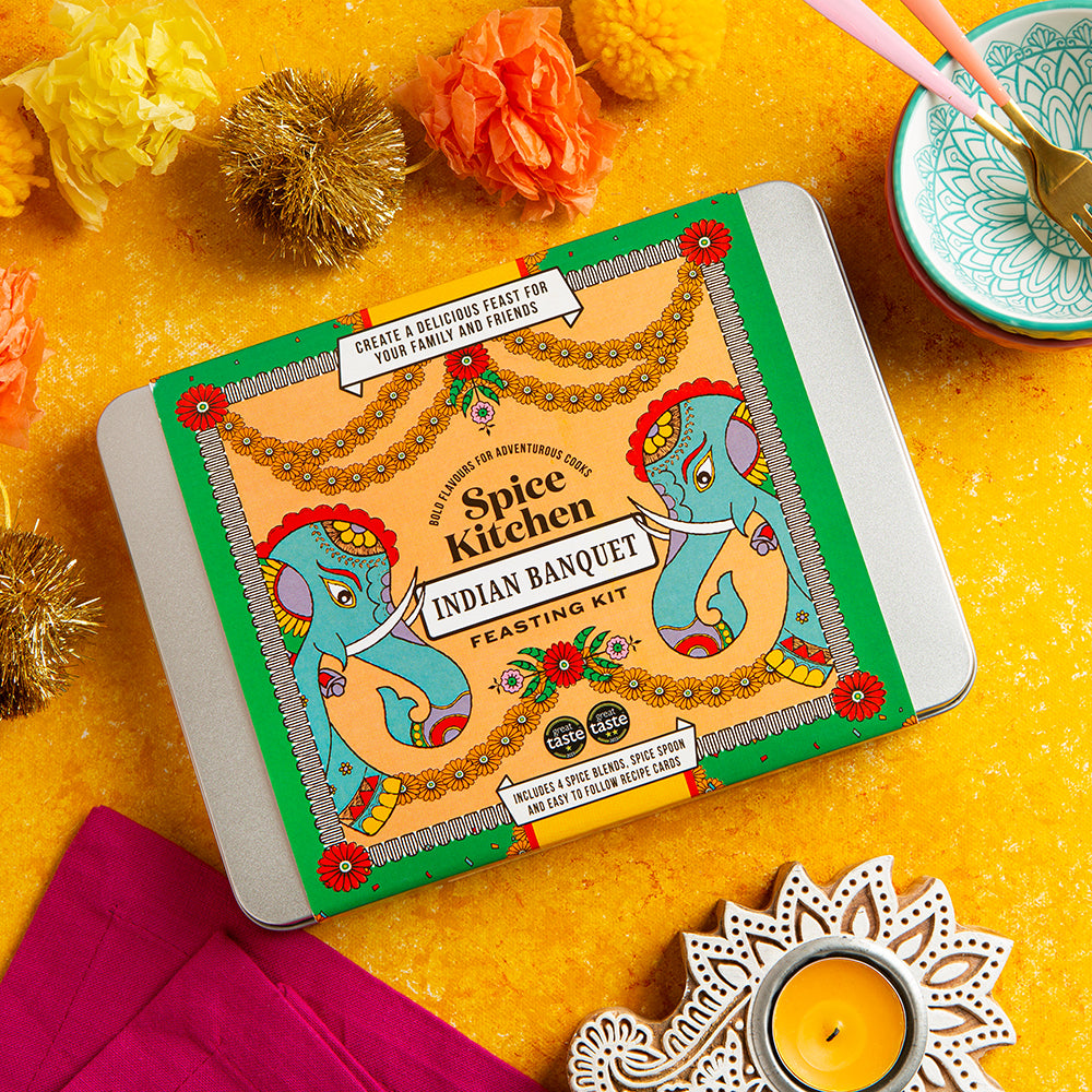 Spice Kitchen Indian Banquet feasting kit on a yellow background with decorative elements.