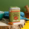 Spice Kitchen Cajun spice tin with a spoonful of spice on a wooden surface.