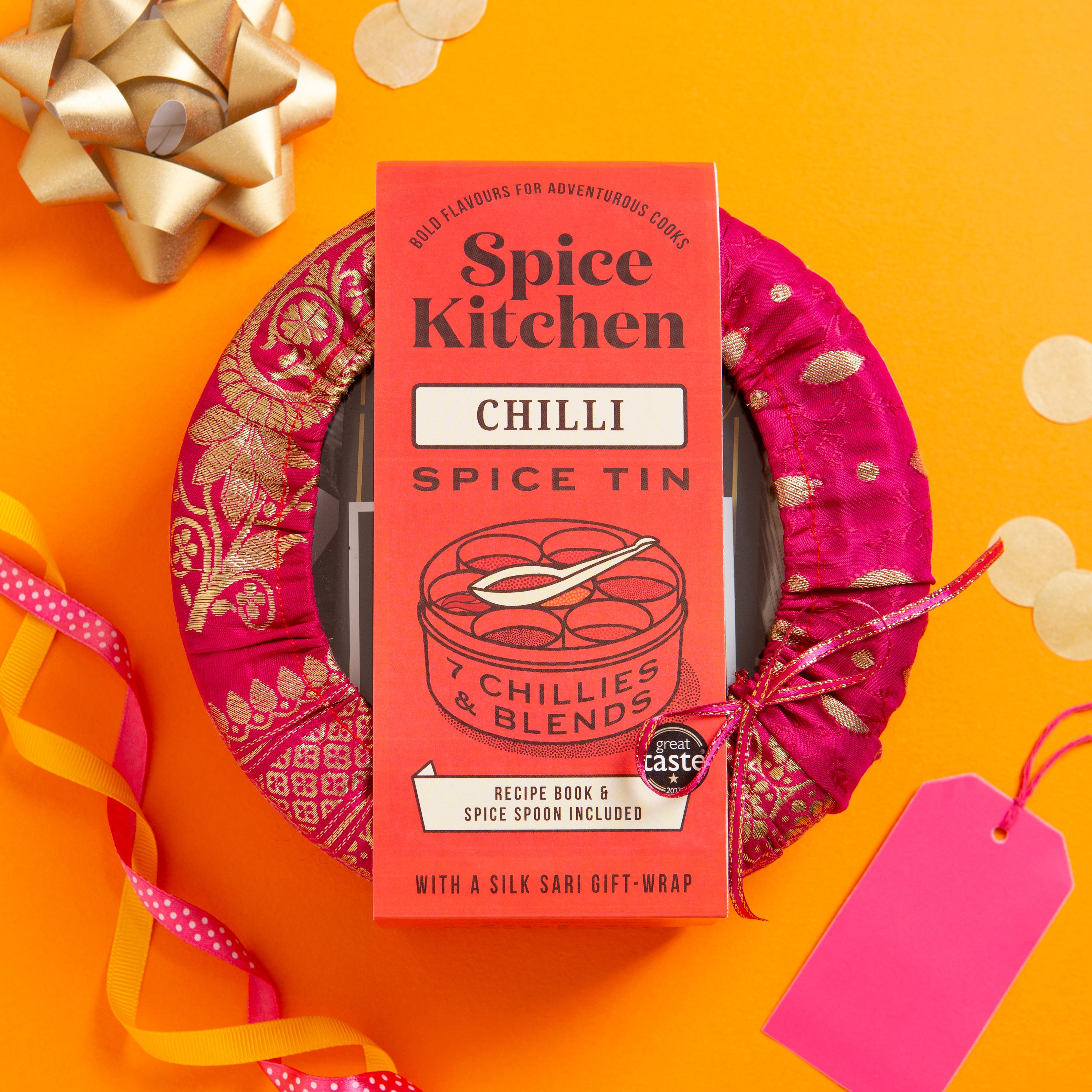 Spice Kitchen Chilli Spice Tin with decorative ribbon and bow on an orange background. International Chilli Collection with 7 Chillies - Spice Kitchen™ - Spices, Spice Blends, Gifts & Cookware