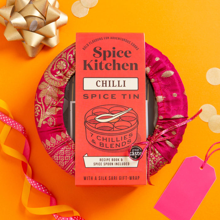 Spice Kitchen Chilli Spice Tin with decorative ribbon and bow on an orange background. International Chilli Collection with 7 Chillies - Spice Kitchen™ - Spices, Spice Blends, Gifts & Cookware