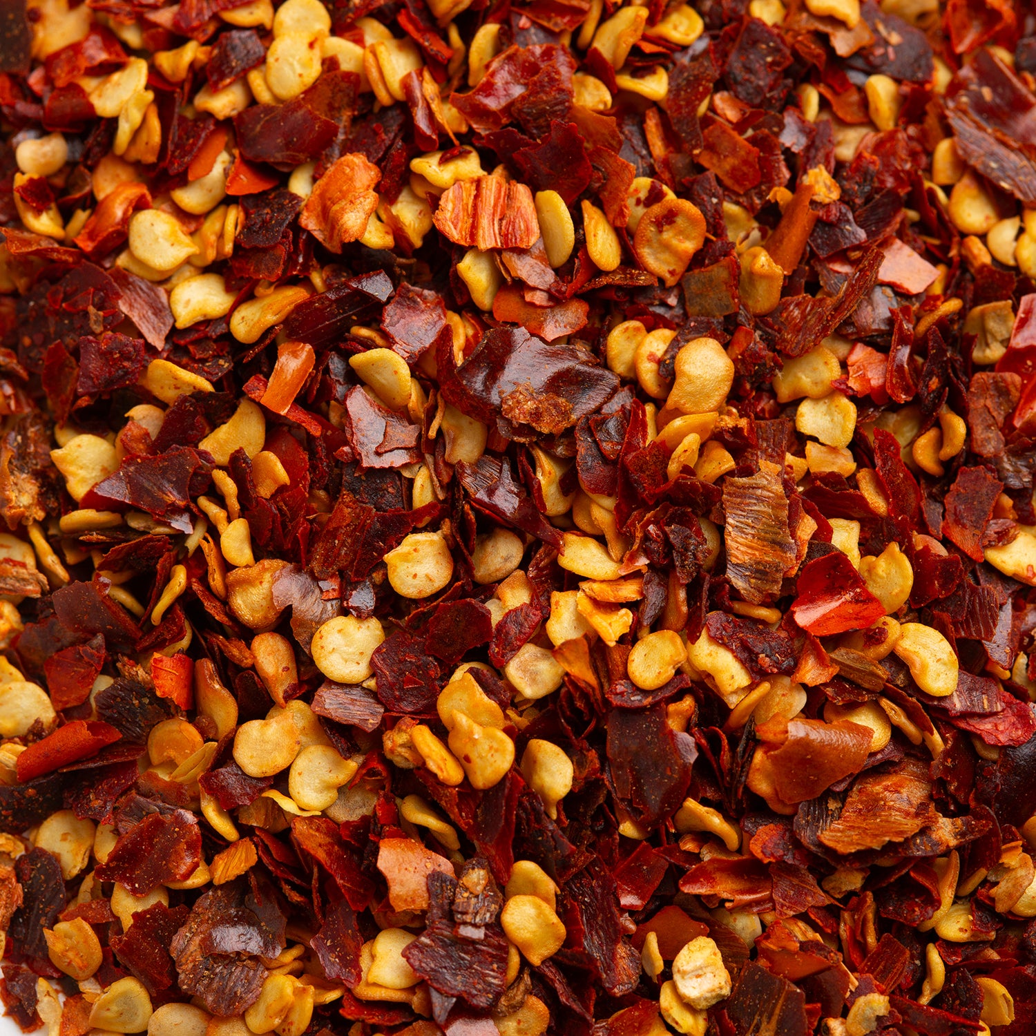 Close-up of dried red and yellow pepper flakes.