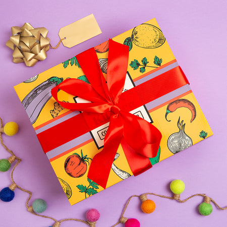Spice Kitchen Middle Eastern gift box hamper with red ribbon on a purple background