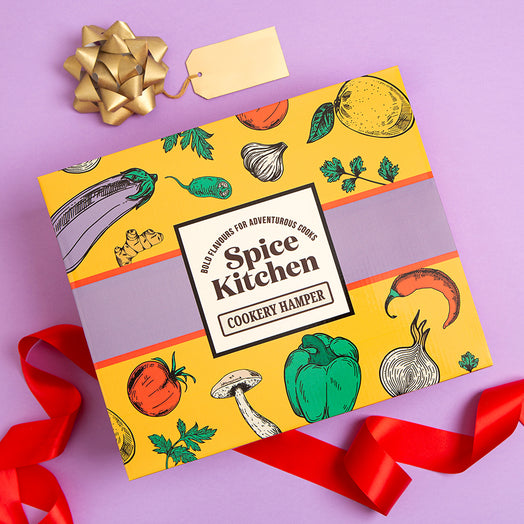 Spice Kitchen Spice Kitchen Signature Spice Blend & Cookery Book Gifting Hamper on a purple background gift box hamper with red ribbon on a purple background