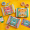 Spice Kitchen Feasting Kit Range on a yellow background with spice spoon, round pots of spice blends, a recipe card and a shopping list